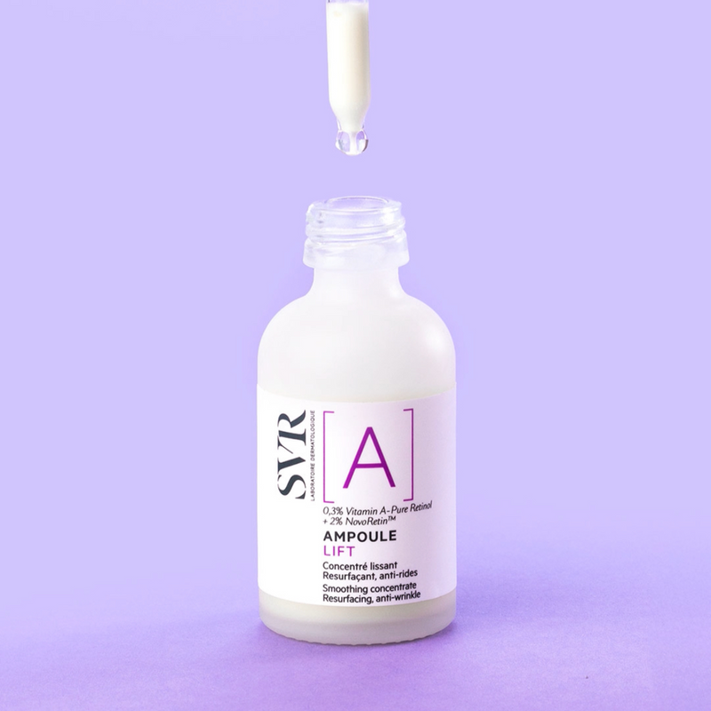 SVR Ampoule Lift retinol serum bottle with a glass dropper, set against a solid light purple background.